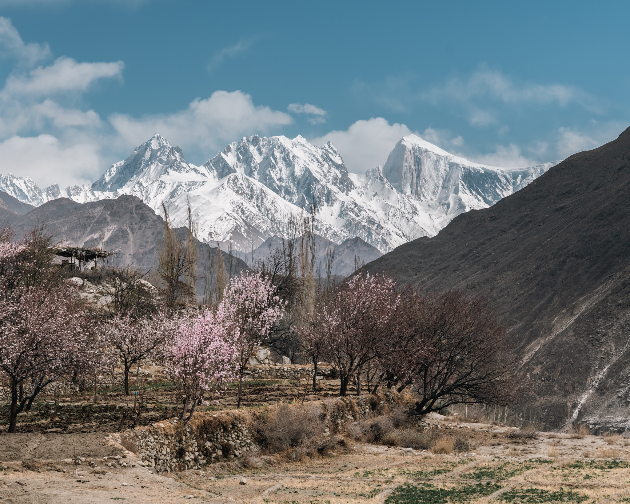 Wide Hunza valley view with sharp peaks on the horizon